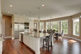 Grand White And Transitional Kitchen With Dark Wood Floors And Tan Painted Walls Designed By Melissa Large Kitchen Island Designs Cabinetry Grand Kitchen
