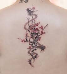 Back Tattoo Dragon Tattoo Ideas Intertwined With Pink Blooming Flowers White Background Dragon Tattoo For Women Fierce Tattoo Dragon Sleeve Tattoos