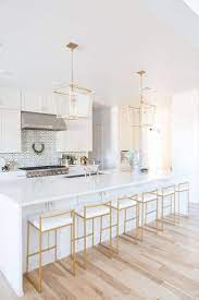 The result is a sleek, bright space. How To Design A Luxurious White And Gold Kitchen White Kitchen Design Kitchen Design Gold Kitchen