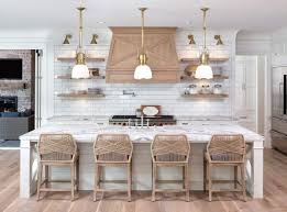 The backsplash contains squared, cream travertine tiles from kitchen hood to the kitchen's countertop. 11 Modern French Country Kitchen Ideas