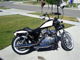 Black And Red Motorcycle Paint Jobs Customized Harley Davidson Sportster 883 Two Tone Ivory And Black Paint Job Separated With A Red Pinstripe Bobbed Rea Harley Davidson Harley White Motorcycle