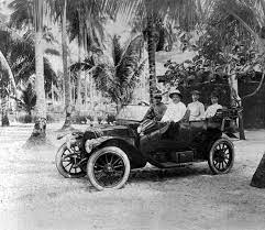 photo of a vintage car with passengers by the singapore art singapore art vintage cars singapore
