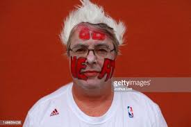 Jon Simpkins shows off his face paint as he poses for a portrait... News  Photo