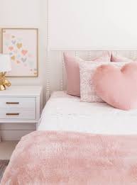 The room offers a cozy bed lighted by two table lamps. Blush Glam Girl Bedroom Reveal The Double Take Girls