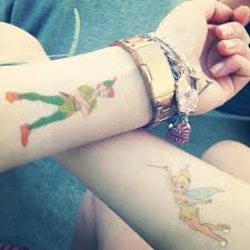 20 Tinkerbell Tattoos And What They Represent Tattoos Peter Pan Tattoo Matching Disney Tattoos