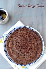 Sweet Dosas Made With Ragi Flour And Jaggery These Sweet Dosas Are Flavored With A Hint Of Ground Cardamom Making These Ragi Dosa Millet Recipes Ragi Recipes