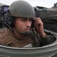 U.S. Marine Corps Staff Sgt. Matthew Copus, left, and