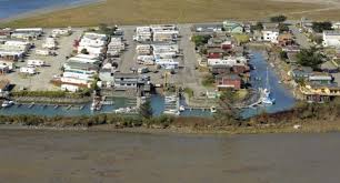 (if coming from the south this will be a left turn across the freeway, if coming from the north this will be a right off the freeway) the park will be on your left just beyond the ramada hotel. Johnny S Marina Rv Park Spottocamp