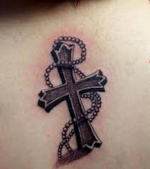 A tribal cross tattoo is the perfect mix of tradition and religion that consists of interlocking patterns and bold intricate designs made with rich black color. 26 Incredible Catholic Tattoos