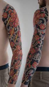 Traditional Japanese Cherry Blossom And Lighting Sleeve Done By Marco Japanese Tattoo Cherry Blossom Traditional Japanese Tattoo Sleeve Japanese Sleeve Tattoos