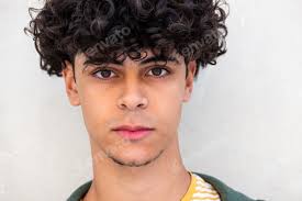 Close up serious young North African man staring Stock Photo by  mimagephotography