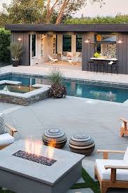Outdoor swimming pool on private residence, lawn, garden. 22 Pool House Design Ideas That Feel Like Vacation