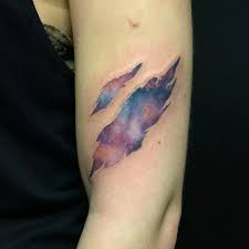 A great tattoo design of an ornate sword that is embedded into the skin and coming out the other side. Brittany Lynn Best Tattoo Ideas Gallery