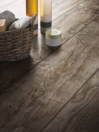 These Rustic Wood Look Tiles From The Daltile Season Wood Tile Collection In Autumn Wood Will Fool Everyone Into Thin Wood Look Tile Wood Tile Floors Wood Tile