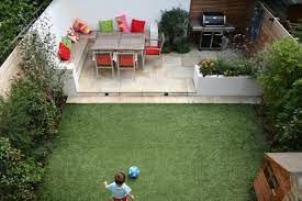 With clean lined minimalism, a floating bench snug by the hill. Contemporary Outdoor Space Designed By Kate Gould Of Kate Gould Gardens And Built By The Garden Small Backyard Design Garden Design London Patio Garden Design