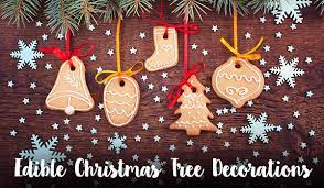 Decorate the other biscuits by icing on silver balls and then thread ribbon through your decorations before dusting with icing sugar. Edible Christmas Decorations The Christmas Cart