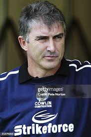 Junior Agogo of Bristol Rovers holds off Chris Willmott of... News Photo