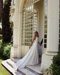 This Soft Silk A Line Gown Is Airy And Romantic Featuring A Beaded Rope That Connects The Hal Rental Wedding Dresses Wedding Dresses Wedding Dress Inspiration