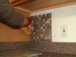 Make sure the tile is lined up properly and perfectly straight before moving on. How To Install A Kitchen Tile Backsplash Hgtv