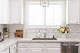 The owners of this queen anne victorian desired a more functional floorplan, improved views to outdoor space, and a period design that would respect the original look of the home. Colonial White Lexi Westergard Design Vermont Remodel Kitchen Subway Tile White Subway Tile Kitchen Kitchen Backsplash Designs White Granite Kitchen