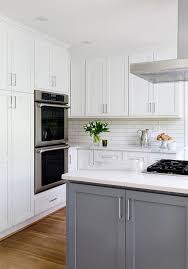 Dark Gray Center Island With A Vent Hood In A Transitional Kitchen With White Perimeter Cabi Transitional Decor Kitchen Transitional Kitchen Home Decor Kitchen