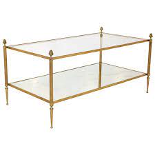 This small round coffee table offers beautiful versatility in every curve. Brass And Glass Coffee Table By Maison Bagues Coffee Table Glass Coffee Table White Coffee Table Modern