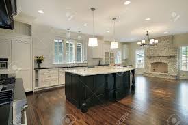 The natural stone looks stunning when incorporated into home design, but particularly so when it is installing or updating your fireplace is a great way to add some visual appeal to your home, while also keeping your house warm. Kitchen And Family Room With Stone Fireplace Stock Photo Picture And Royalty Free Image Image 6739729