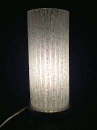 Candles are held in place and the flame is protected by the glass shell. Glass Cylinder Table Lamp Ideas On Foter