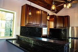 Should you put kitchen cabinets in your tiny house? The Paradise Tiny House Features Stunning Woodwork And Gourmet Kitchen