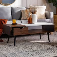 The beautiful faux marble exterior and iron foundation of this living room table is guaranteed to wow visitors and show your style. Carson Carrington Saltaro Faux Marble Top Coffee Table On Sale Overstock 20479263