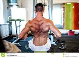 Muscular Man On Daily Workout Routine At Gym Close Up Of