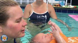 2 year old Shannon singing Pop Goes the Weasel to dolly in pool