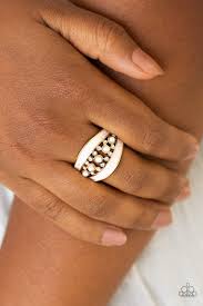 Studded gold bars and bands of glassy white rhinestones cross and arc across the finger, coalescing into a glamorously stacked frame. Royal Treasury Gold Paparazzi Ring Jewelryblingthing