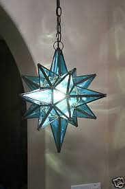 Hanging light fittings and light fixtures including chandeliers that are ideal for lighting high ceilings. Table Moravian Star Lamp