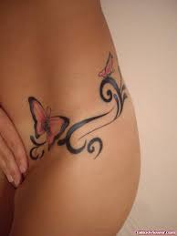 The first thing to consider when getting a thigh tattoo is the actual design itself. Butterfly And Tribal Tattoo On Hip