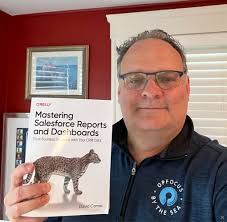 Very cool moment for me, to be holding the first copy of my book Mastering  Salesforce Reports & Dashboards! It is now available