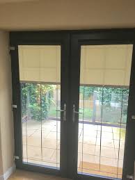 Order quality made to measure window blinds from make my blinds. Patio Doors With Perfect Fit Roller Blinds In Grey Frame 1 Murphys Blinds