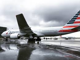 In the first class the seats. American Airlines Boeing 777 200 Pulling Into The Gate On A Rainy Day Aviation