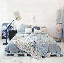 Palette Bed With Cozy Blankets And Lots Of Pillows Pallet Bed Frame Diy Pallet Bed Pallet Bed
