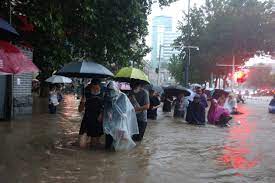 Alibaba, tencent, bytedance and meituan rush to support a courier wades through a waterlogged road in zhengzhou, capital of central china's henan province on july 20, 2021. Kamm5swqxrg9fm