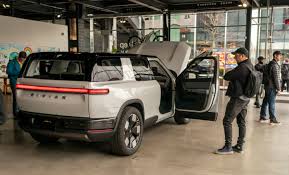 Exclusive | EV Startup Rivian Lays Off Hundreds of Workers