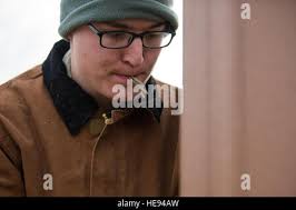 Airman 1st Class Joshua Scott, 51st Civil Engineer Squadron firefighter,  examines a simulated injured victim during Exercise Beverly Midnight 16-01,  March 9, 2016, at Osan Air Base, Republic of Korea. This scenario