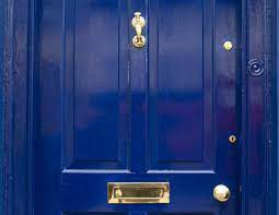 Hang a wreath with touches of blue for a pulled together look. Best Feng Shui Front Door Colors