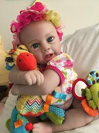 Diana Spurlin's Rachael doll is dressed in bright colors and ready for the  weekend! How are your dolls spending the weekend? Rachael & Ramsey:  https://www.paradisegalleries.com/products/lifelike-newborn-baby-doll-ensemble-rachael-ramsey