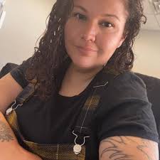 Looking for a tattoo artist that can do something with small/medium sized  writing that won't cost an arm & leg.