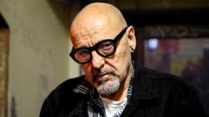 An old punk talks to a young punk