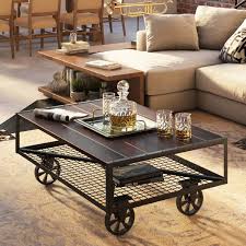 Vintage caster wheel coffee table with black metal corners. Adelanto Industrial Style Cart Coffee Table With Caster Wheels