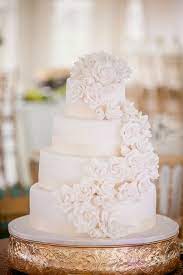 Looking for other ways to make a white wedding cake feel more modern? White Wedding Cake With Cascading Sugar Flowers