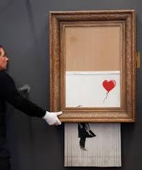 Banksy has since released a video on how the shredder was installed into the frame and the shredding of the picture, explaining that he had surreptitiously fitted the painting with the shredder a few years previously, in case it ever went up for auction. Self Shredding Banksy Painting Goes On Display In Germany Reuters