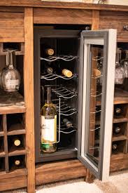 We took careful measurements of the cooler and then added 2 to the width of the opening. Wine Cooler Cabinet Wine Cabinet Diy Wine Fridge Cabinet Wine Rack Design